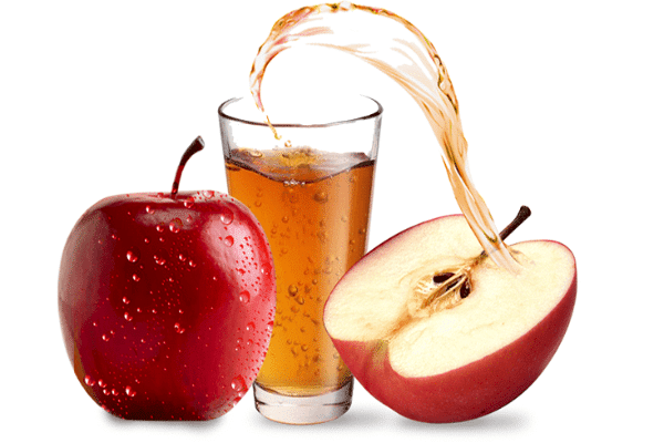 Fresh pressed apple juice in elegant glass bottles surrounded by ripe apples and orchard scenery